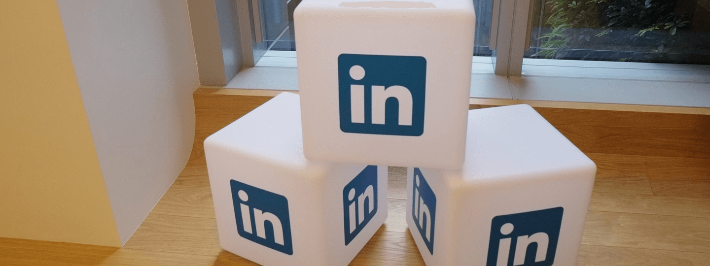 White cubes with the Linkedin logo on each side